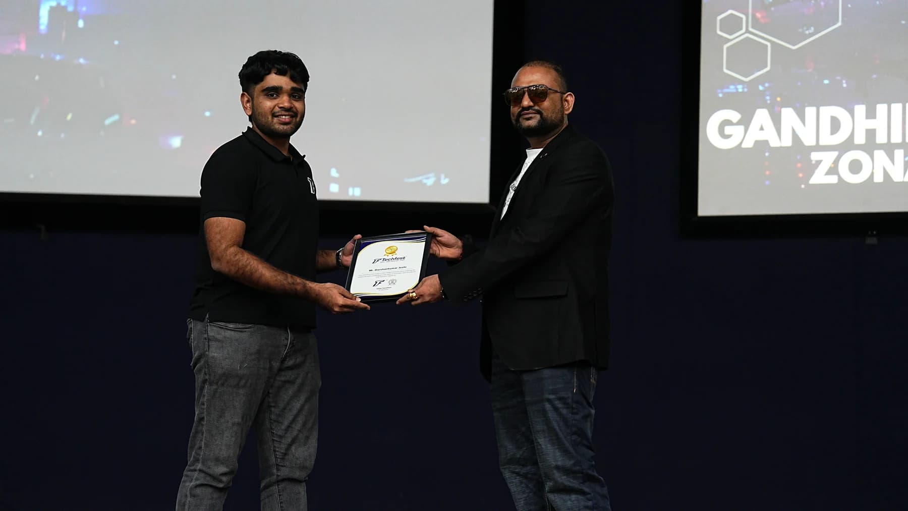 Darshankumar Joshi receiving a Techfest appreciation certificate at a 2025 event